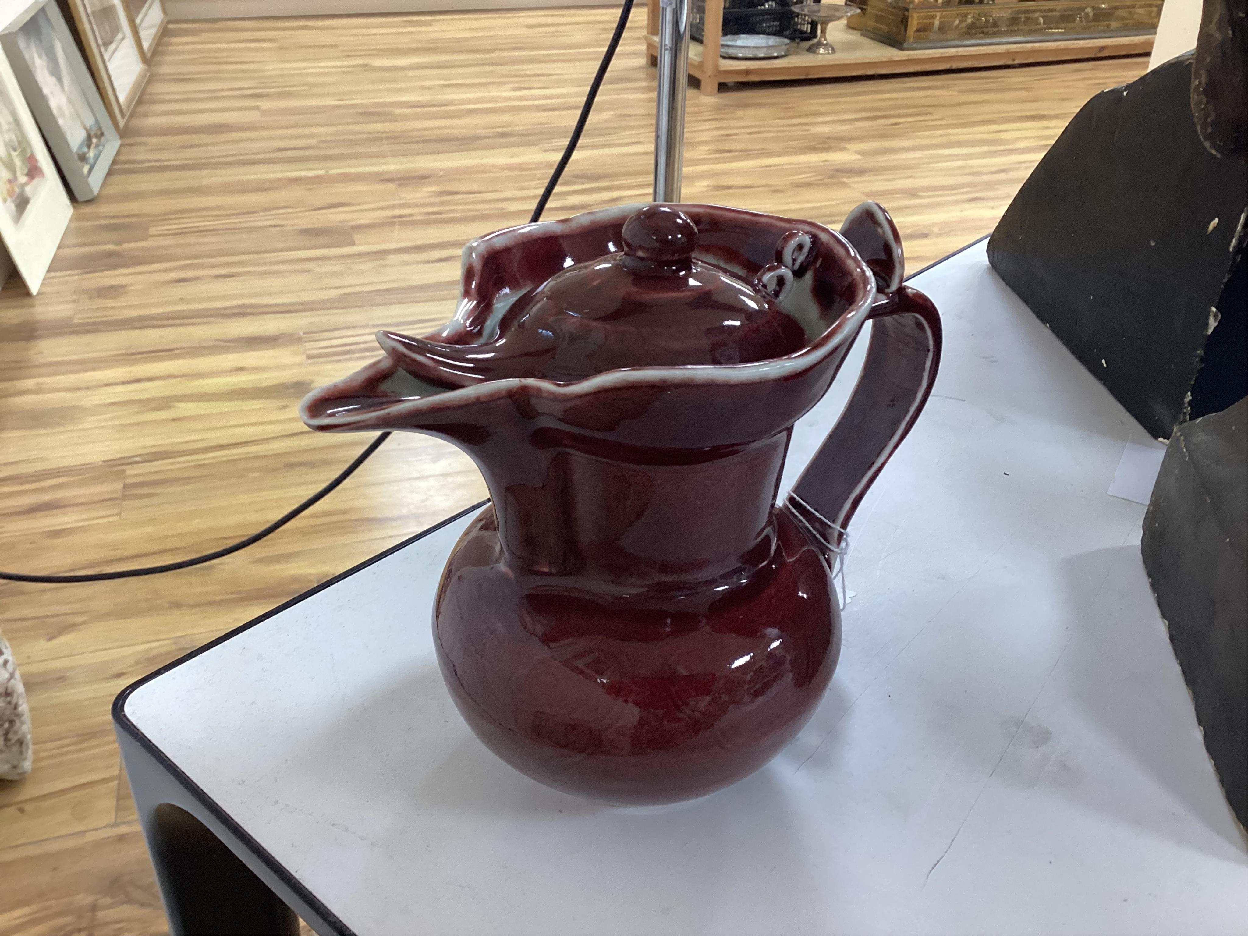A Chinese famille noire ‘dragon’ dish, 22.5cm diameter, and a Sang de boeuf glaze monk’s cap ewer, Condition - good